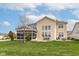 Two-story house with large patio, screened porch, and landscaped yard at 6252 Sugar Maple Dr, Zionsville, IN 46077