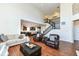 Open living room with kitchen views, hardwood floors, and a staircase to upper level at 6252 Sugar Maple Dr, Zionsville, IN 46077