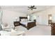 Main bedroom with carpeted floor, trey ceiling and ensuite bathroom at 6252 Sugar Maple Dr, Zionsville, IN 46077