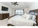 Bright main bedroom with large bed, dresser, and view of backyard at 6252 Sugar Maple Dr, Zionsville, IN 46077