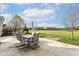 Spacious patio with seating for outdoor dining and views of backyard at 6252 Sugar Maple Dr, Zionsville, IN 46077