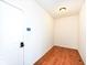 Small room with hardwood floors and a door at 6252 Sugar Maple Dr, Zionsville, IN 46077