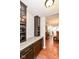 Convenient wet bar with wine storage and granite countertop at 6252 Sugar Maple Dr, Zionsville, IN 46077
