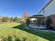 Well-maintained backyard with a fire pit area and manicured landscaping at 794 Princeton Ln, Westfield, IN 46074
