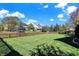 The backyard boasts an expansive manicured lawn and classic wood fence line at 794 Princeton Ln, Westfield, IN 46074