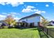 Expansive backyard featuring green grass, a wooden fence, and a view of the home's exterior at 794 Princeton Ln, Westfield, IN 46074