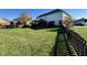 A spacious backyard showcasing lush green grass and a classic fence line at 794 Princeton Ln, Westfield, IN 46074