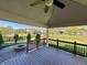 Spacious backyard featuring a fire pit, covered patio, and manicured lawn with mature trees at 794 Princeton Ln, Westfield, IN 46074