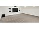 Spacious basement with a built-in entertainment center and plush carpet, perfect for gatherings at 794 Princeton Ln, Westfield, IN 46074