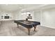 Finished basement with billiards table, wet bar, and open living area for entertaining guests at 794 Princeton Ln, Westfield, IN 46074