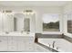 Bright bathroom featuring a double vanity, soaking tub, and window at 794 Princeton Ln, Westfield, IN 46074