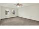 Bright bedroom featuring soft carpet, a ceiling fan, and windows providing natural light at 794 Princeton Ln, Westfield, IN 46074
