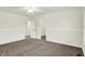 Spacious bedroom featuring plush carpet, a ceiling fan, and a walk-in closet for ample storage at 794 Princeton Ln, Westfield, IN 46074
