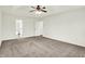 Spacious bedroom featuring soft carpet, ceiling fan, and multiple doorways for convenience at 794 Princeton Ln, Westfield, IN 46074