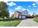 Beautiful red brick and vinyl two story home with a three-car garage and nice landscaping at 794 Princeton Ln, Westfield, IN 46074