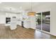 Modern kitchen boasts white cabinets, stainless steel appliances, and sliding doors to the deck at 794 Princeton Ln, Westfield, IN 46074