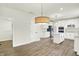 Bright, spacious kitchen featuring white cabinets, a center island, stainless steel appliances, and modern lighting at 794 Princeton Ln, Westfield, IN 46074