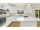 Well-equipped kitchen showcases white cabinets, stainless steel appliances, and center island at 794 Princeton Ln, Westfield, IN 46074