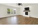 Bright living room featuring a modern fireplace and a sunlit window at 794 Princeton Ln, Westfield, IN 46074