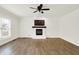 Spacious living room with a ceiling fan, hardwood floors, and brick fireplace at 794 Princeton Ln, Westfield, IN 46074