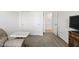 Bedroom featuring neutral carpet, closet, television, and an open doorway at 17871 Paula, Westfield, IN 46074