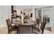 Open-concept dining area with table, six chairs, and sliding glass doors leading to the deck at 17871 Paula, Westfield, IN 46074