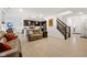 View of an open-concept living area with wood floors and a staircase at 17871 Paula, Westfield, IN 46074