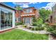 A backyard featuring a pond, stone patio, and manicured lawn creating a serene outdoor space at 2505 Riverside Dr, Columbus, IN 47201