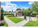 Brick home with well-manicured lawn and three-car garage at 2505 Riverside Dr, Columbus, IN 47201