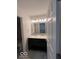 A bathroom with a double vanity, undermount sinks and marble countertops at 6362 Harmonridge Ct, Indianapolis, IN 46278