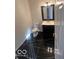 Modern bathroom featuring a sleek black marble floor, vanity, and toilet at 6362 Harmonridge Ct, Indianapolis, IN 46278