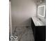 Bathroom vanity with granite countertops, a lighted mirror, and tile flooring at 6362 Harmonridge Ct, Indianapolis, IN 46278