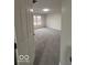 Entryway into a neutral bedroom with plush carpeting and natural lighting at 6362 Harmonridge Ct, Indianapolis, IN 46278