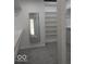 Walk-in closet with custom shelving and a mirror for added convenience at 6362 Harmonridge Ct, Indianapolis, IN 46278