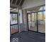 Outdoor porch with brick accents and a view of the kitchen at 6362 Harmonridge Ct, Indianapolis, IN 46278