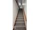 Carpeted staircase with a wooden banister leading to the upper level at 6362 Harmonridge Ct, Indianapolis, IN 46278