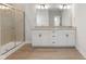 Double vanity bathroom with granite countertop, white cabinets and a large shower at 804 James William Ln, Westfield, IN 46074