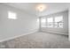 Simple bedroom with grey carpet and large windows at 804 James William Ln, Westfield, IN 46074