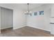 Empty dining room with hardwood floors and a chandelier at 804 James William Ln, Westfield, IN 46074