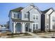 Two-story house with gray siding, dark gray shutters, and a front porch at 804 James William Ln, Westfield, IN 46074