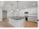 Modern kitchen with white cabinets, granite countertops, and stainless steel appliances at 804 James William Ln, Westfield, IN 46074