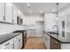 Modern kitchen with white cabinets, granite countertops, and stainless steel appliances at 804 James William Ln, Westfield, IN 46074