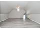 Bonus room with wood look floors, neutral paint, natural light, and plenty of space at 1709 Hoyt Ave, Indianapolis, IN 46203