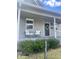 Inviting front porch with chairs and a decorative wreath on the door, offering a cozy curb appeal at 1709 Hoyt Ave, Indianapolis, IN 46203