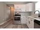 Well-equipped kitchen features stainless steel appliances, white cabinets, and sleek hardware at 1709 Hoyt Ave, Indianapolis, IN 46203