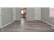 Open-concept living room with hardwood flooring and a view of the kitchen at 1709 Hoyt Ave, Indianapolis, IN 46203