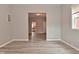 Cozy living room with hardwood floors and open to the kitchen at 1709 Hoyt Ave, Indianapolis, IN 46203