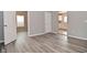 Living room features hardwood floors and access to the kitchen area at 1709 Hoyt Ave, Indianapolis, IN 46203