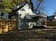Backyard view with new wooden fence, lawn and walkway at 212 S Good Ave, Indianapolis, IN 46219