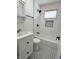 Updated bathroom features white subway tile, black fixtures, and a vanity at 212 S Good Ave, Indianapolis, IN 46219